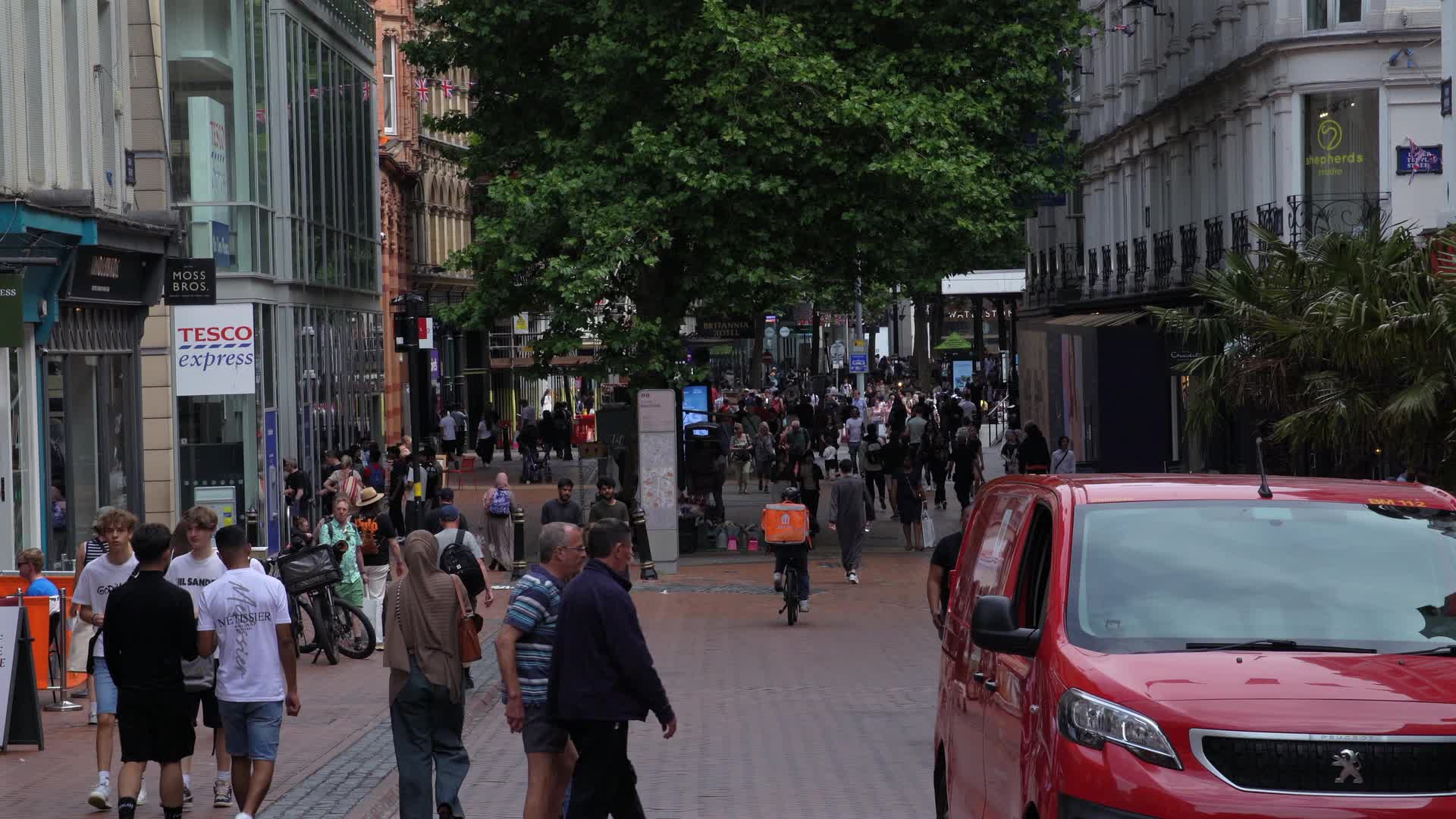 Busy Shopping Scene on New Street in Birmingham, UK