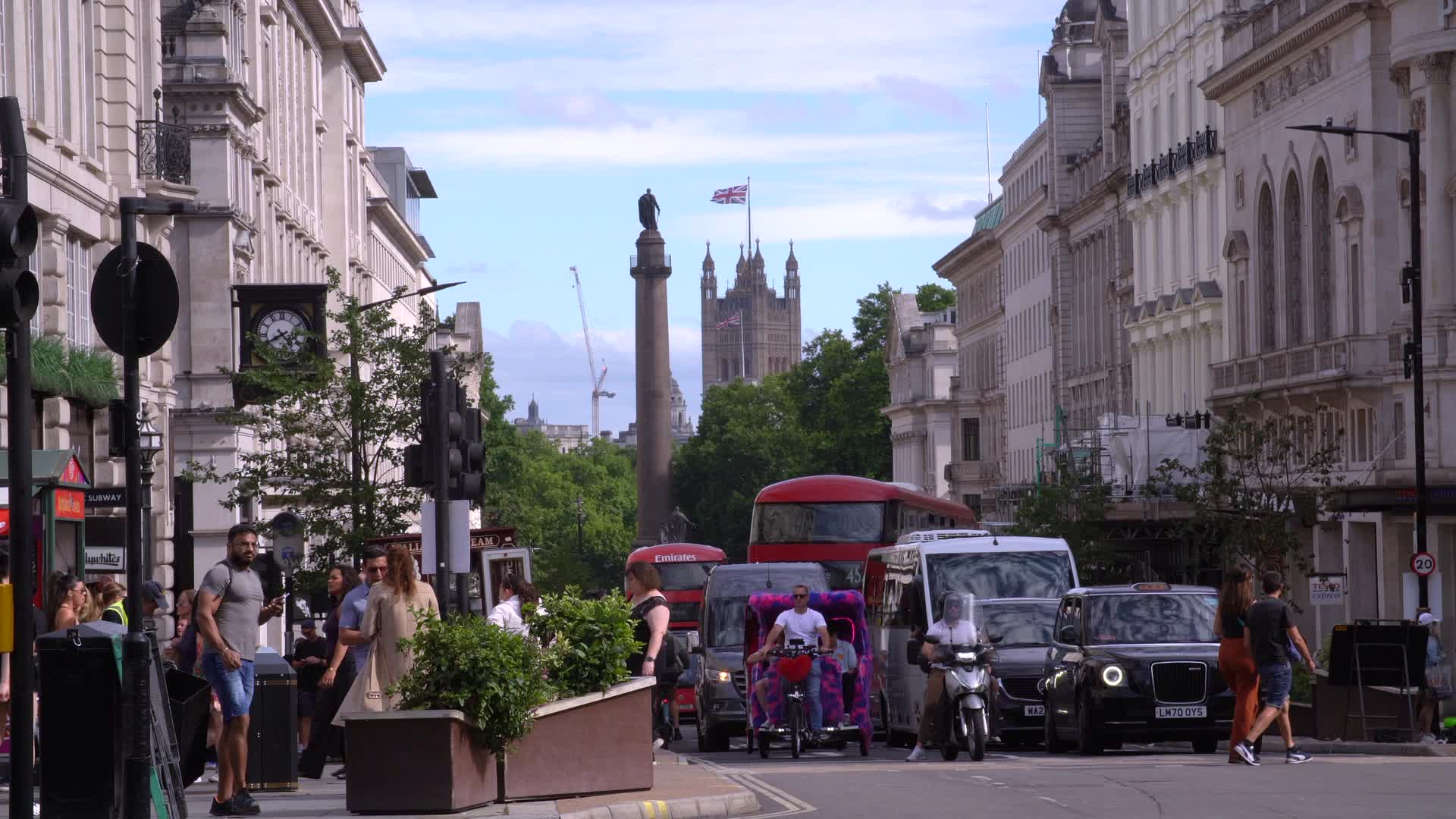 London Street Scene with Union Flag and Red Buses
