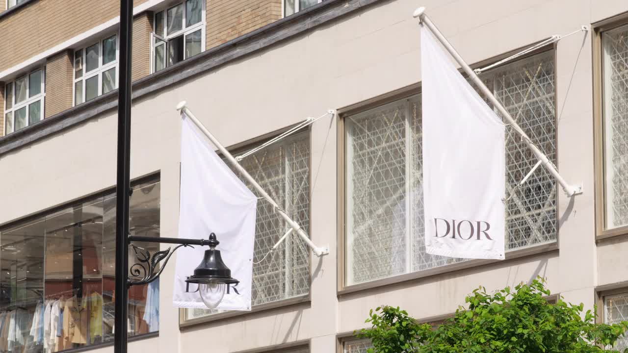 Dior Storefront with Flags and Shopping Display in London