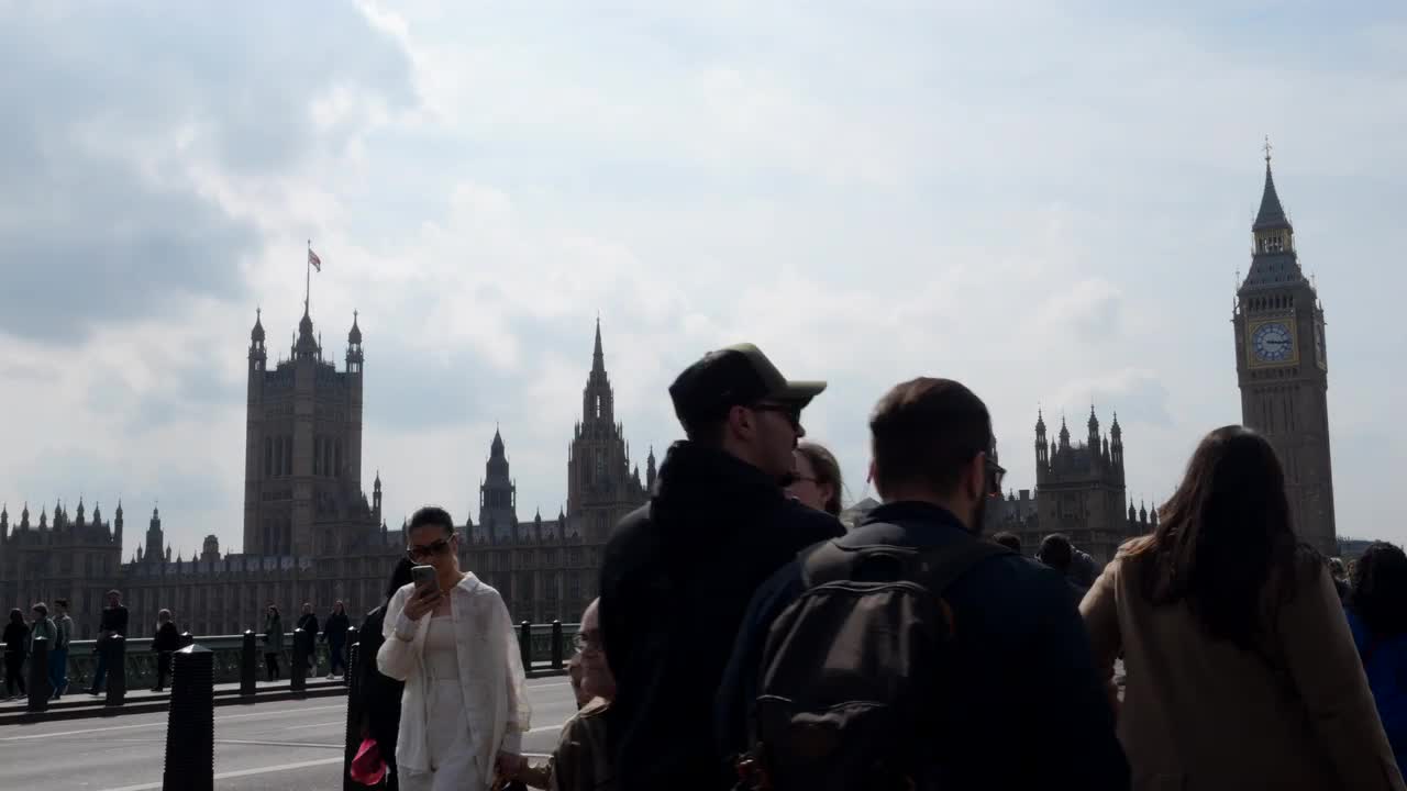 Crowd by UK Parliament and Big Ben on a Cloudy Day