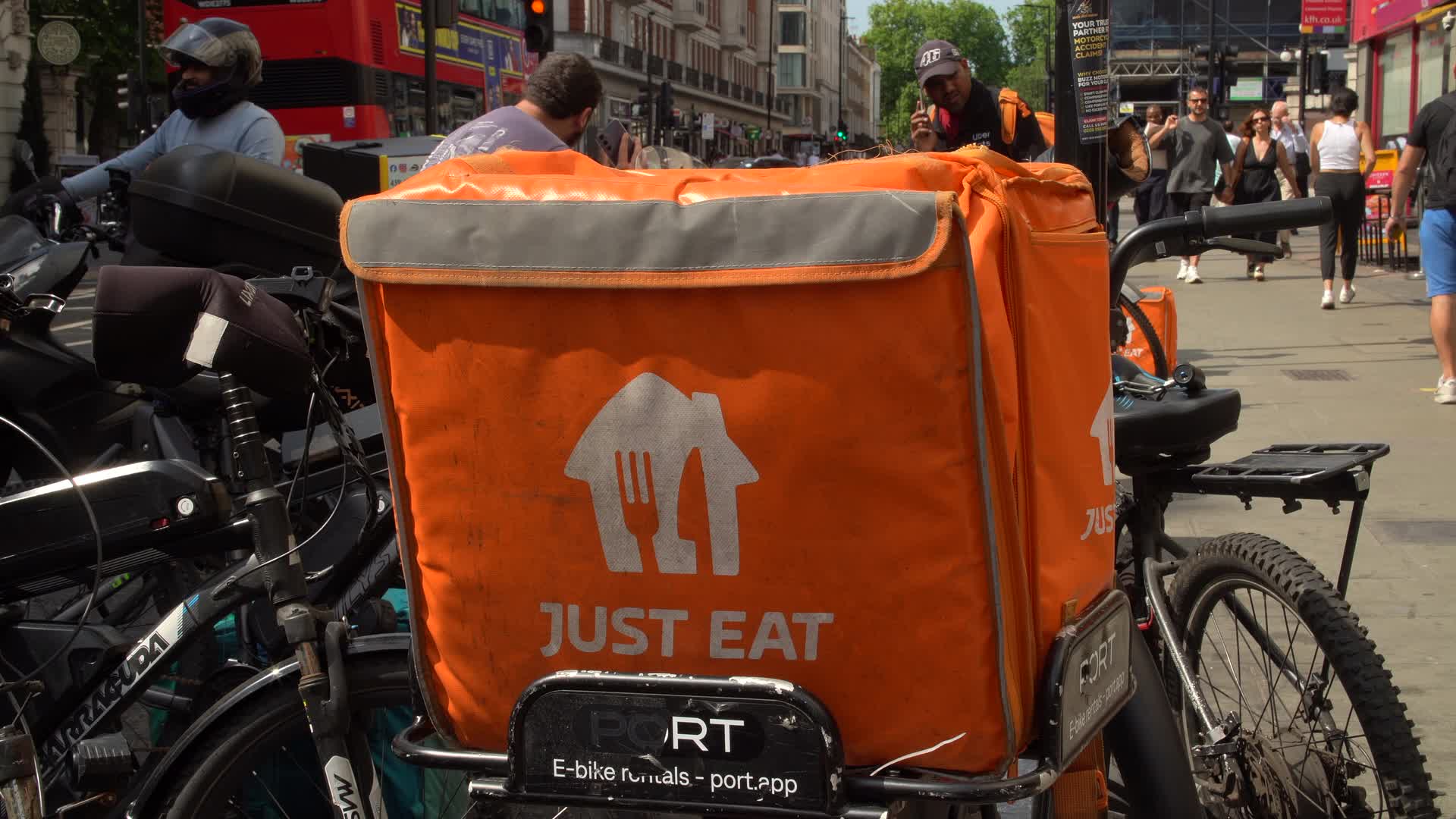 Just Eat Delivery Bikes in Bustling London City Street