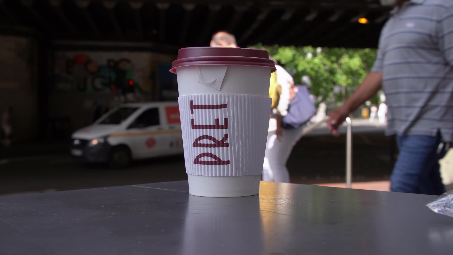 Pret a Manger Coffee Cup on Table in Urban Setting