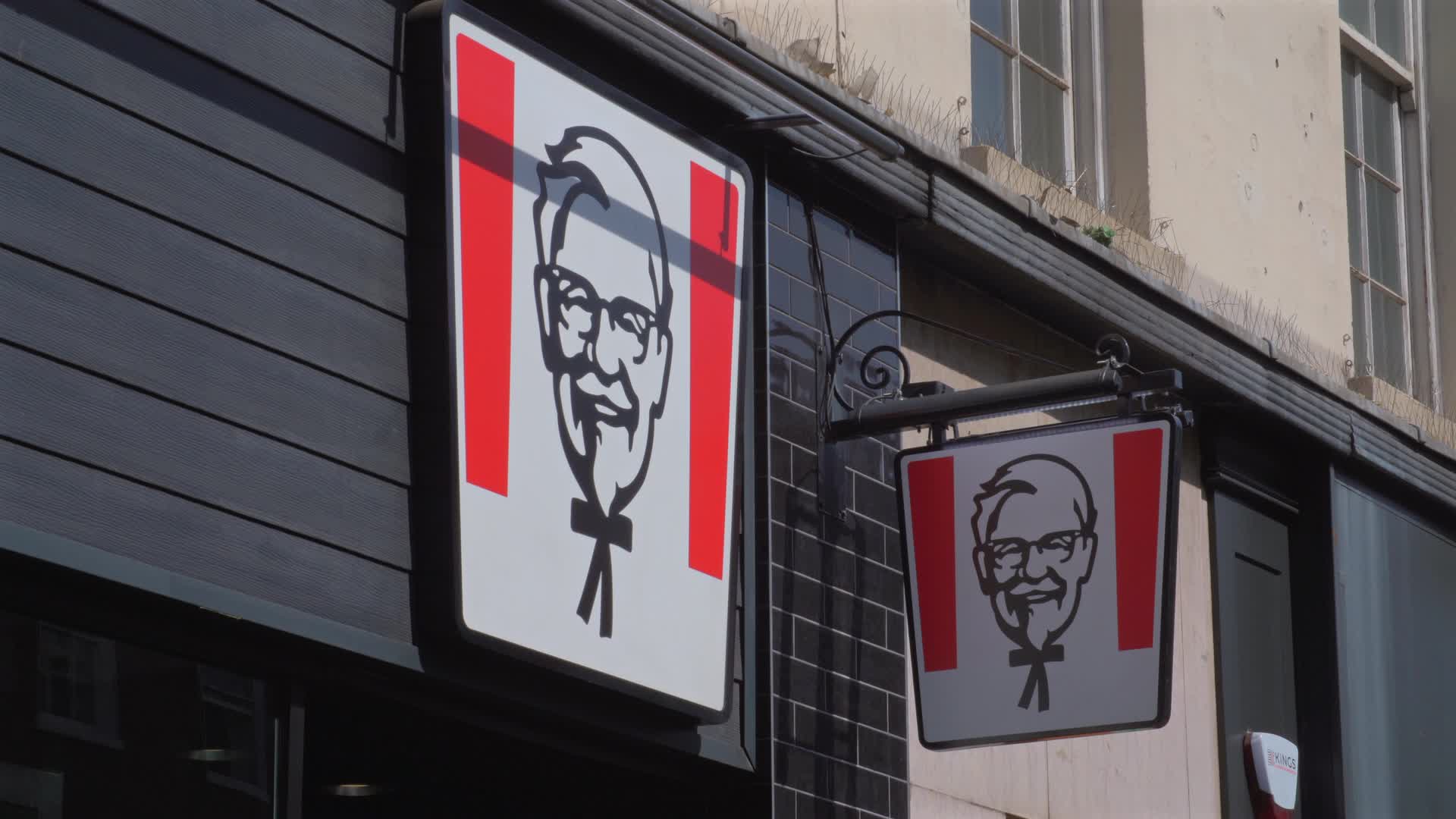 KFC Restaurant Exterior Signage on Sunny Day in London, UK