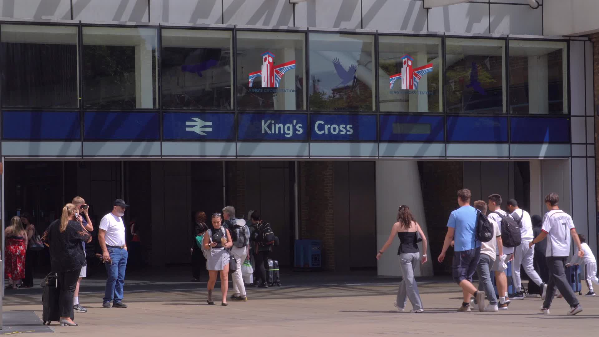 Busy Day at King's Cross Station Entrance in London, UK