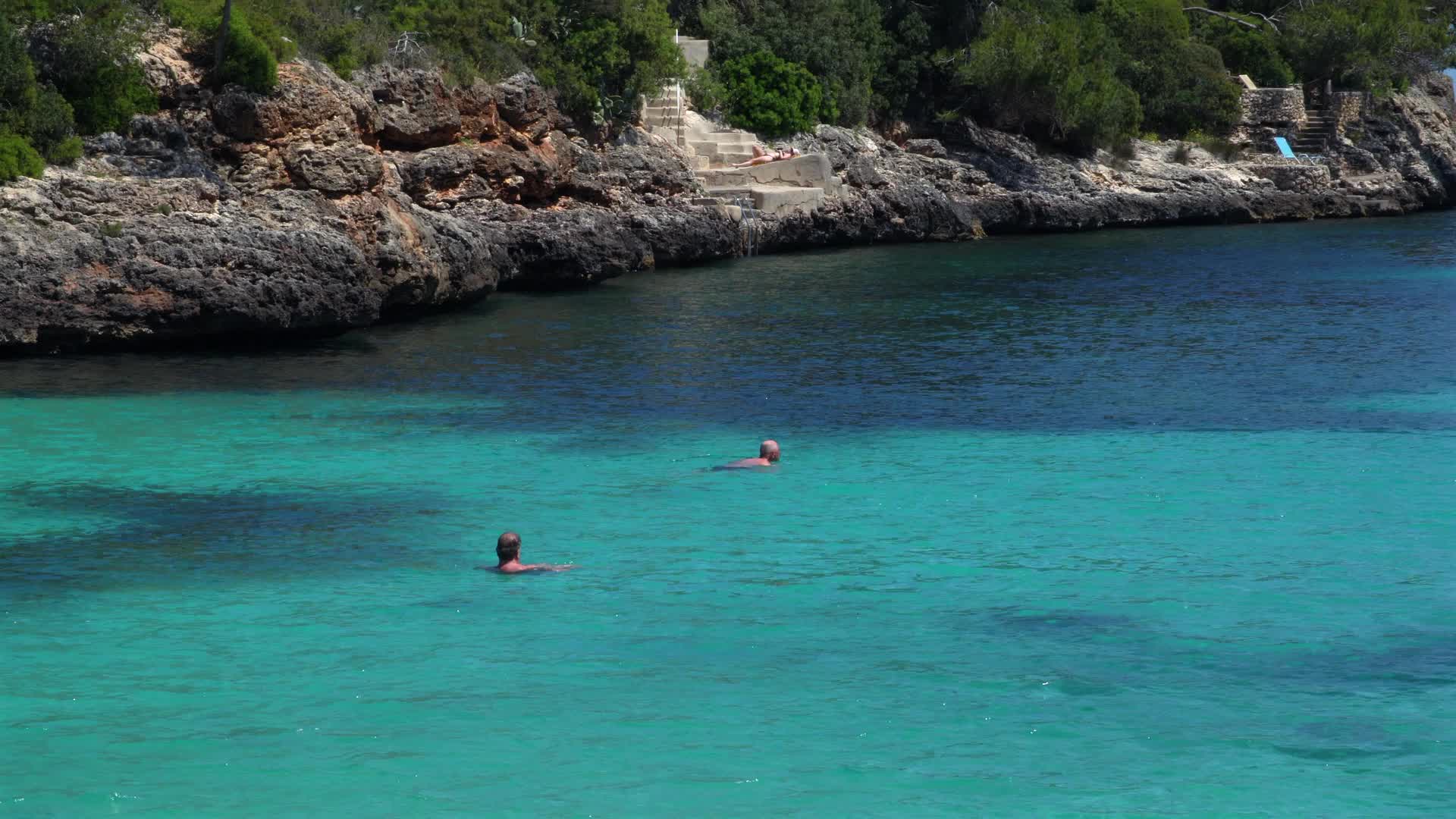 Tranquil Swim in Blue Water at Cala d'Or Beach, Mallorca