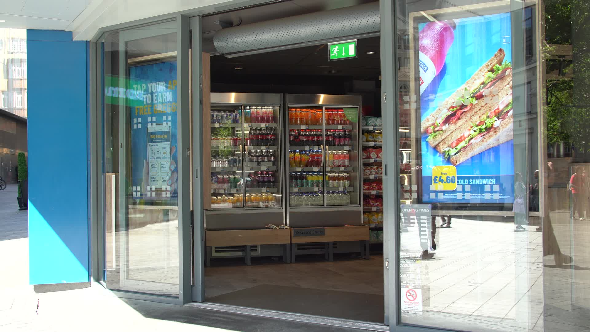 Greggs Storefront with Open Doors and Beverage Display