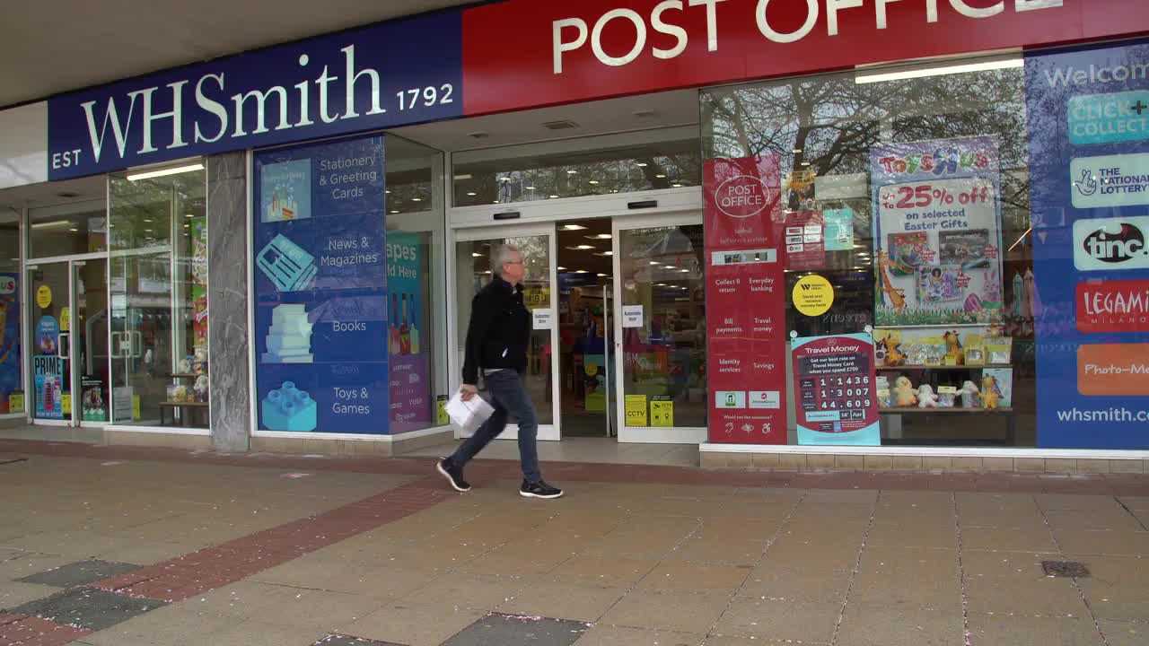 Entrance of WHSmith and Post Office on a Busy Street