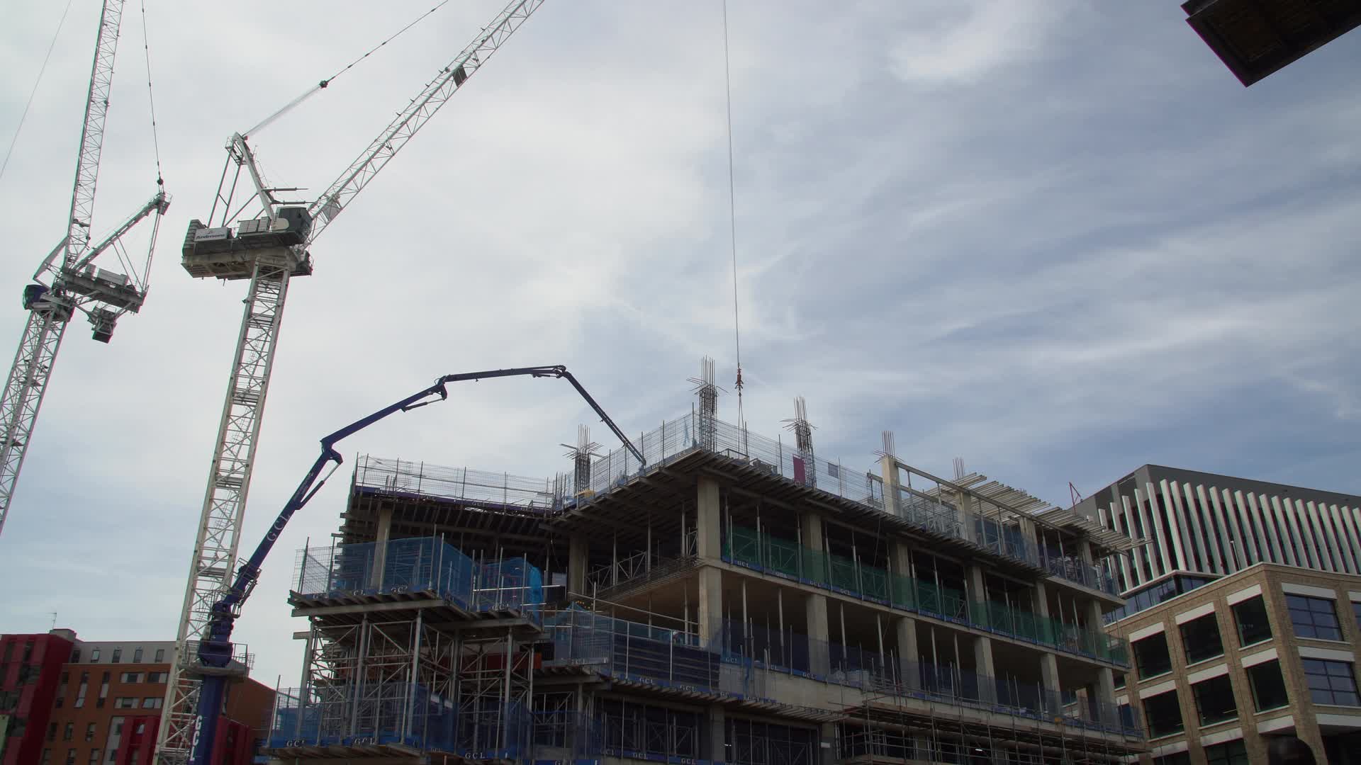 Urban Construction Site Along Canal with Cranes in London