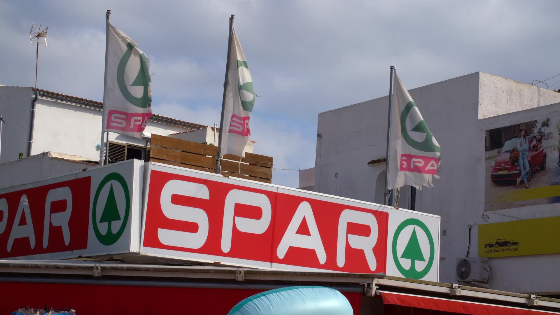 SPAR Storefront with Flags in Cala d'Or, Mallorca, Spain