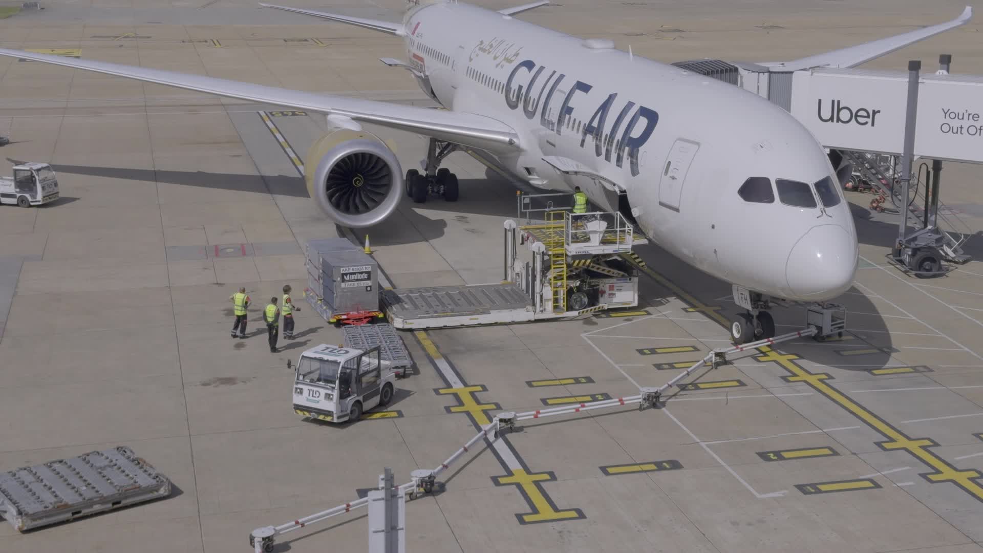 Gulf Air Aircraft at Airport Gate with Ground Crew
