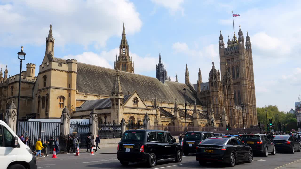 Traffic and Pedestrians Outside UK Parliament in London