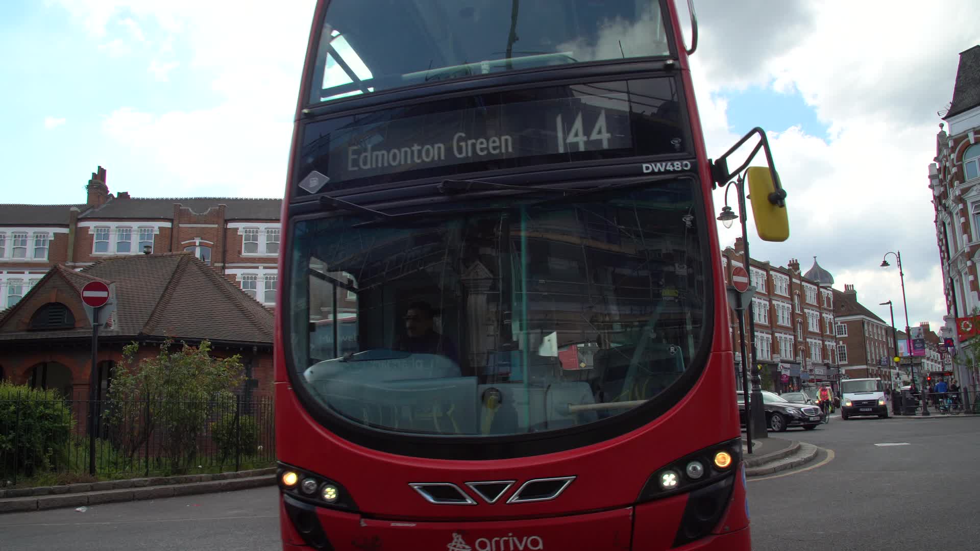 London Red Double-Decker Bus at Busy Intersection
