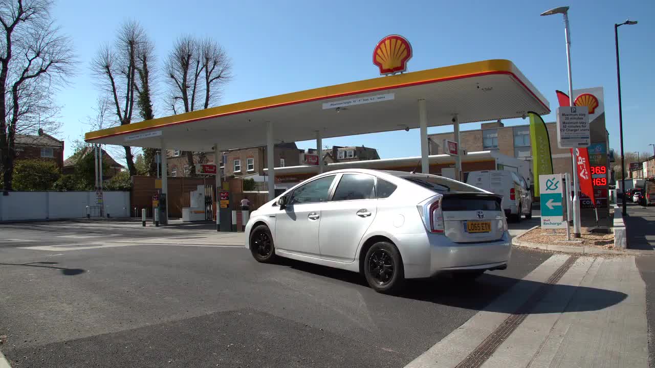 Modern Urban Shell Gas Station Scene with Car