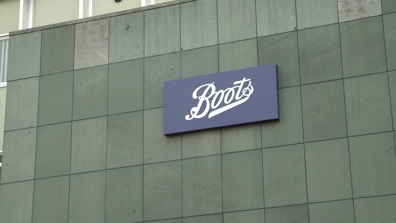 Boots Storefront Signage on Urban Building