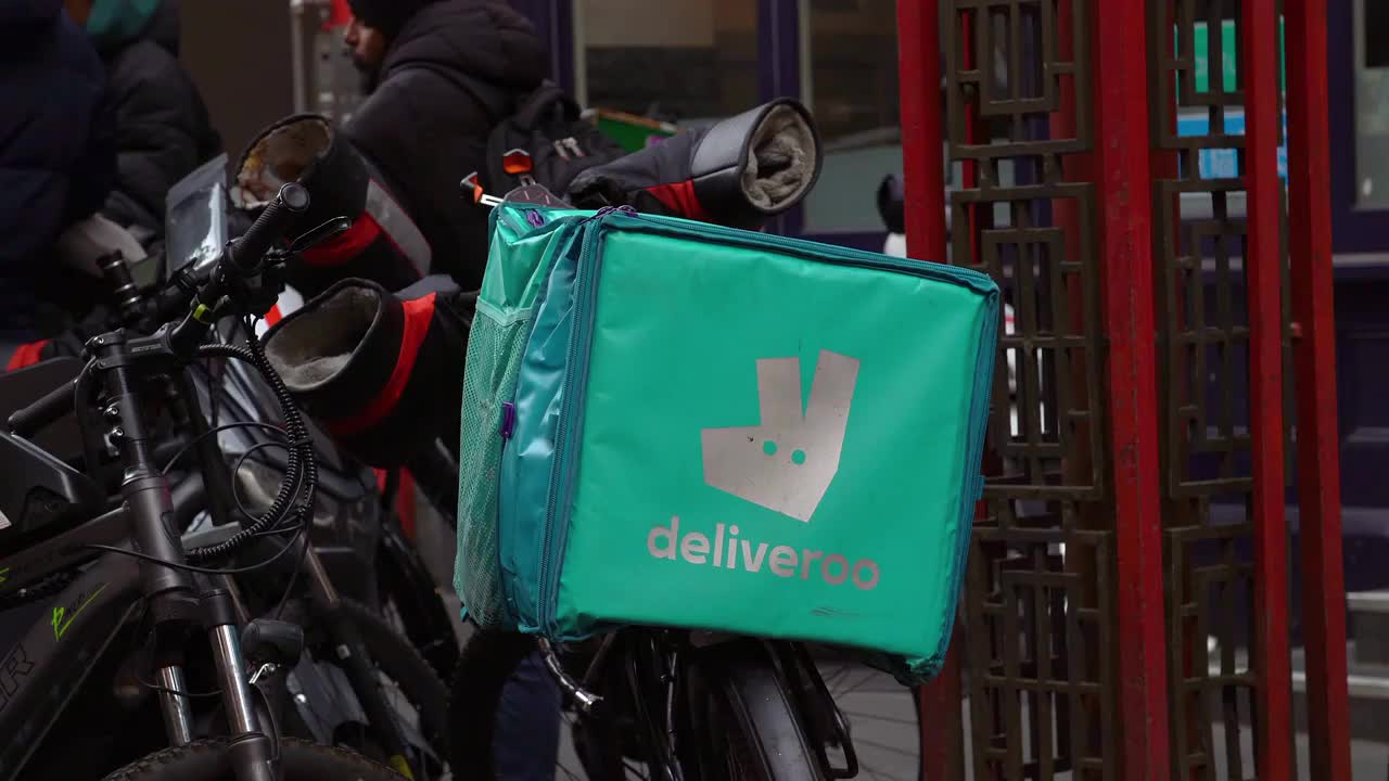 Deliveroo Bicycle Courier in Urban Setting