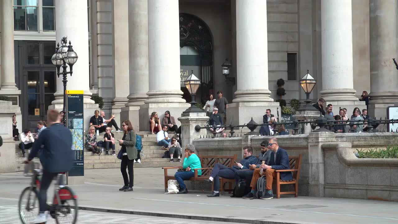 People Relaxing Outside Royal Exchange London