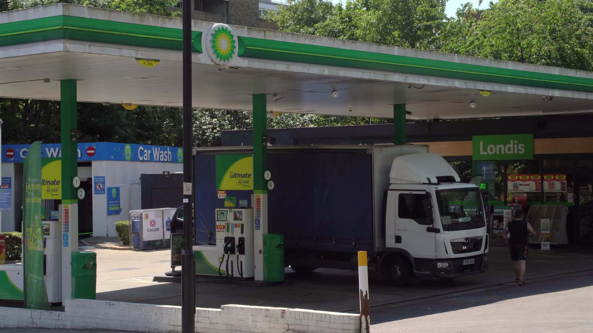 BP Service Station with Delivery Truck in Sunny Day