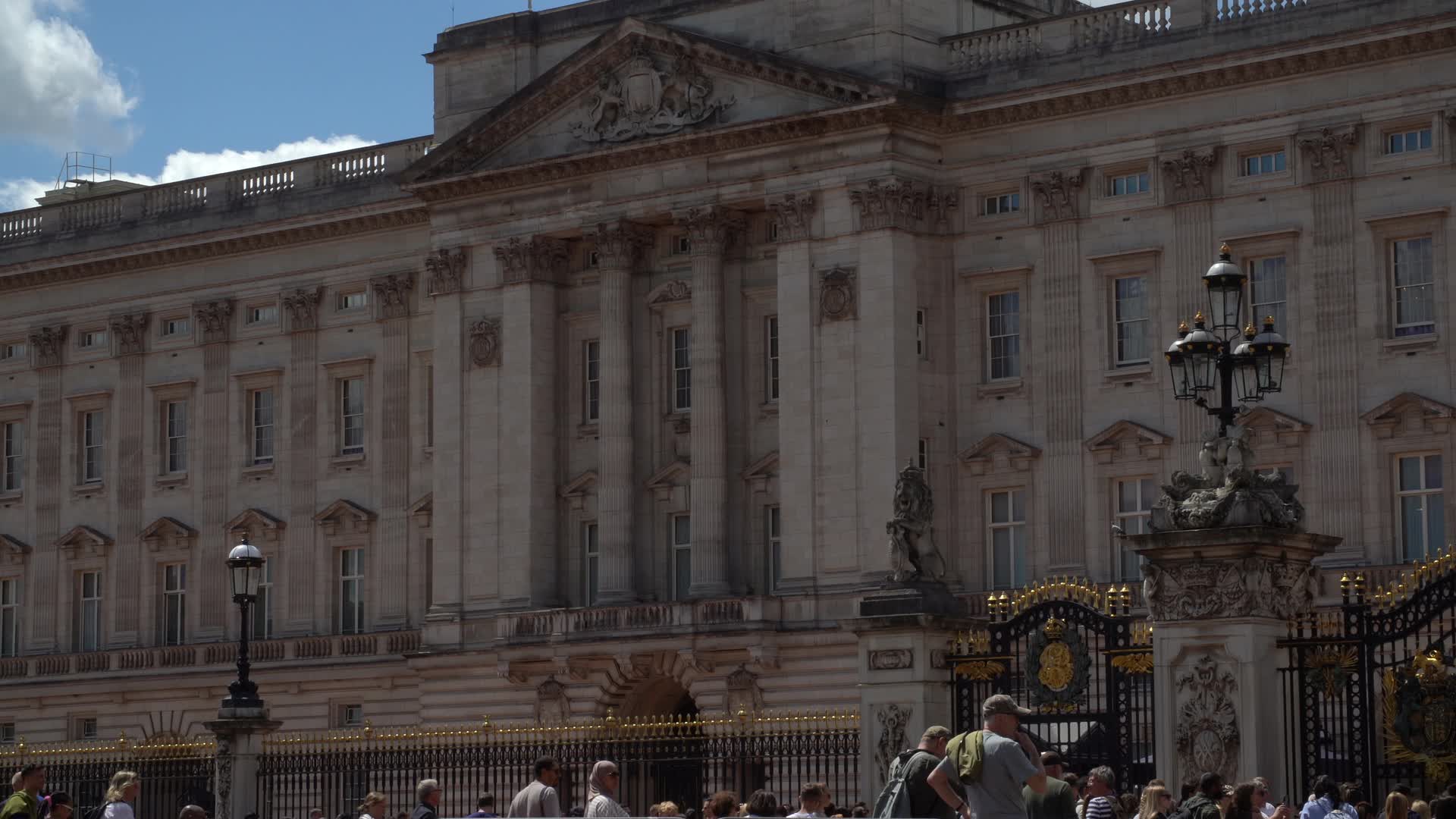 Buckingham Palace Front View with Tourists