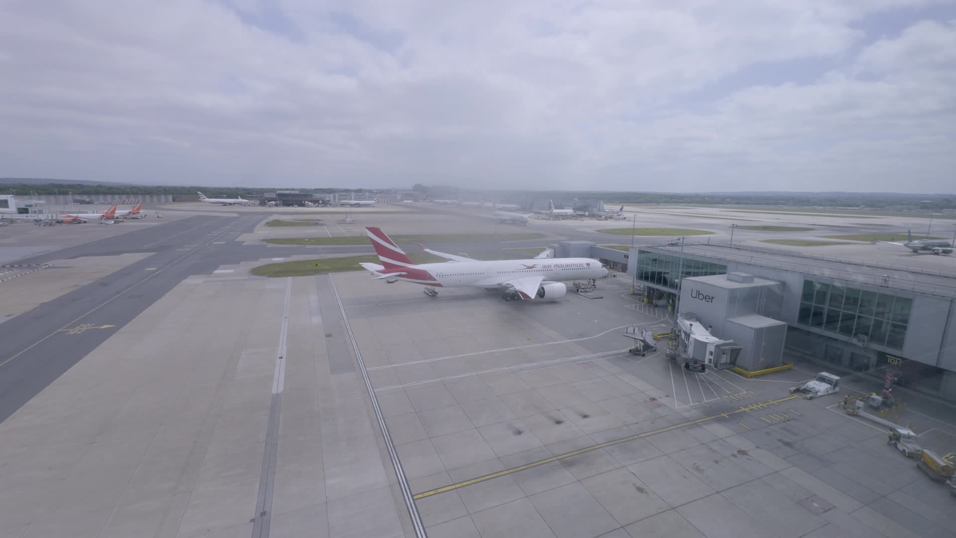 Gulf Airplane at Airport on Cloudy Day
