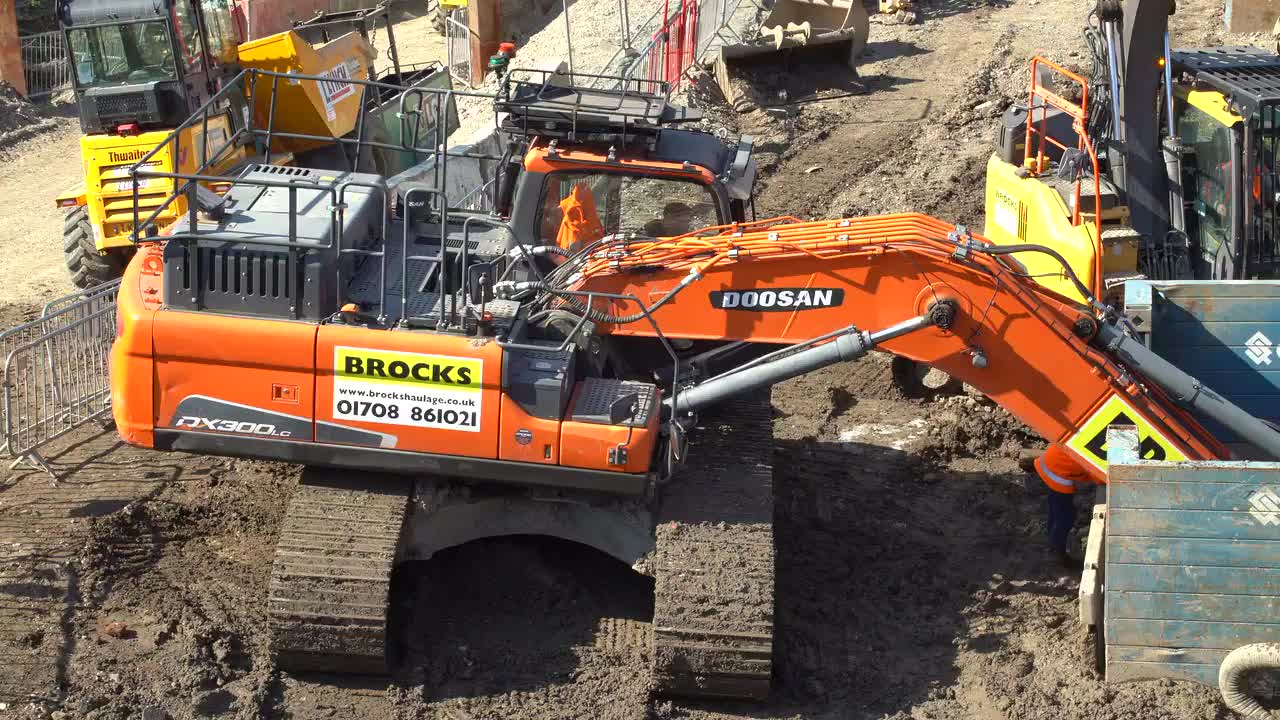 Excavator and Bulldozer at Urban Construction Site