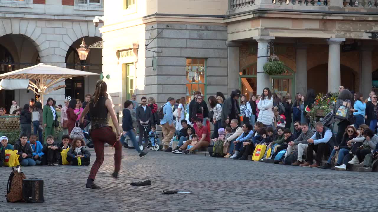 Street Performer Entertains Crowd in Covent Garden