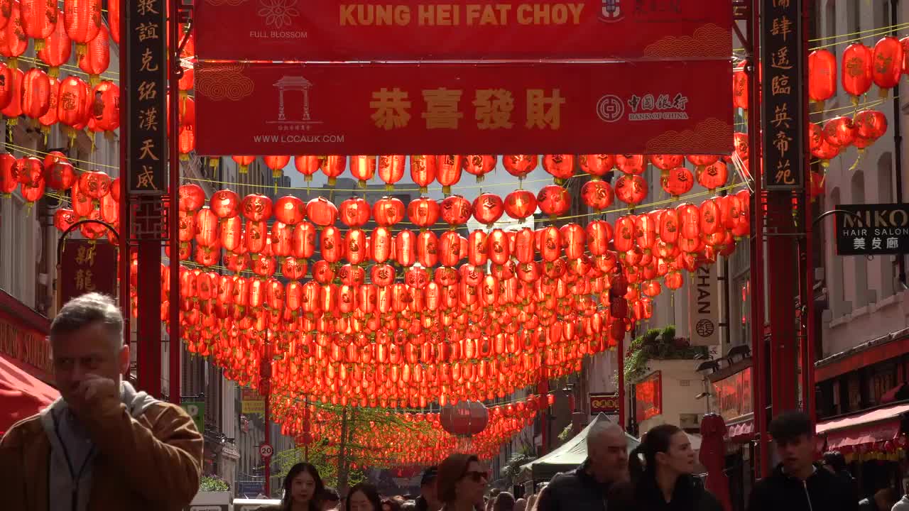 Bustling Scene in Soho's Chinatown with Red Lanterns