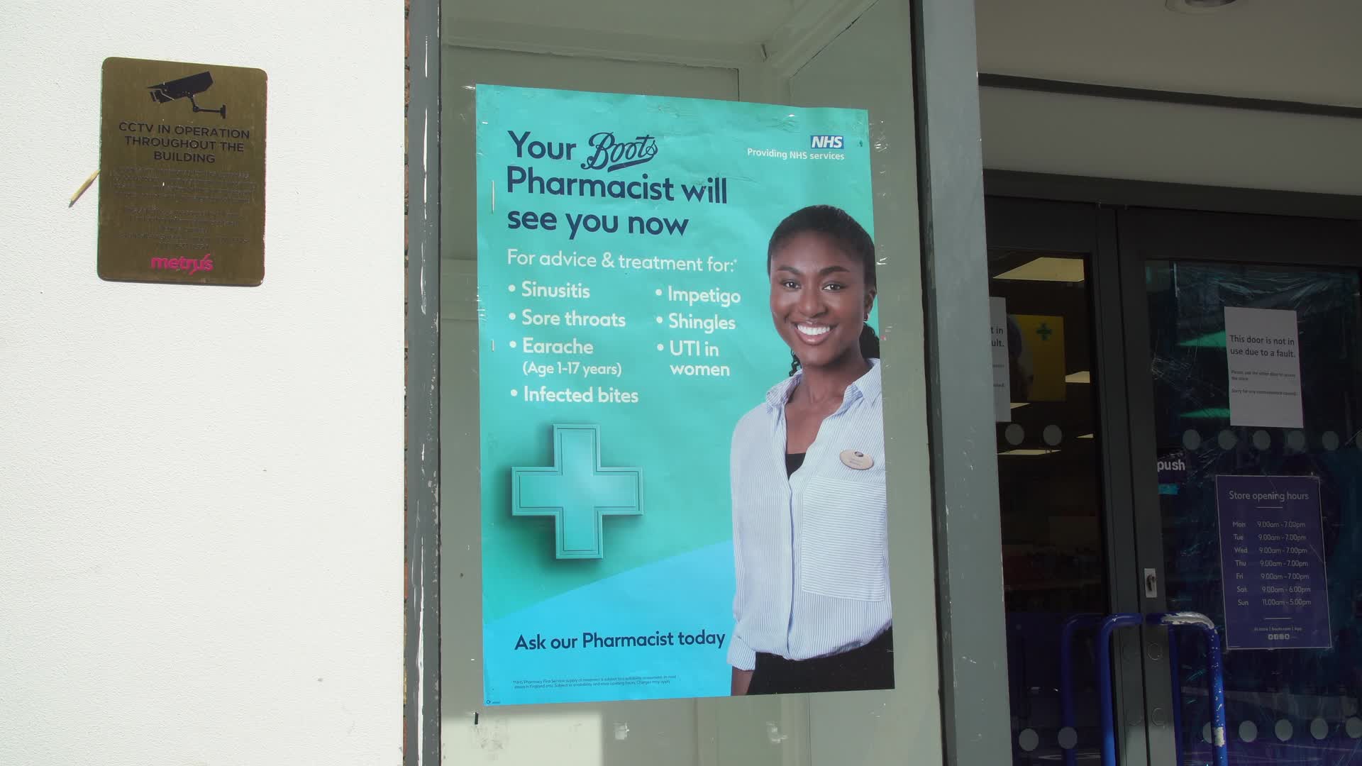 Boots Pharmacy Entrance with Health Advice Poster in London