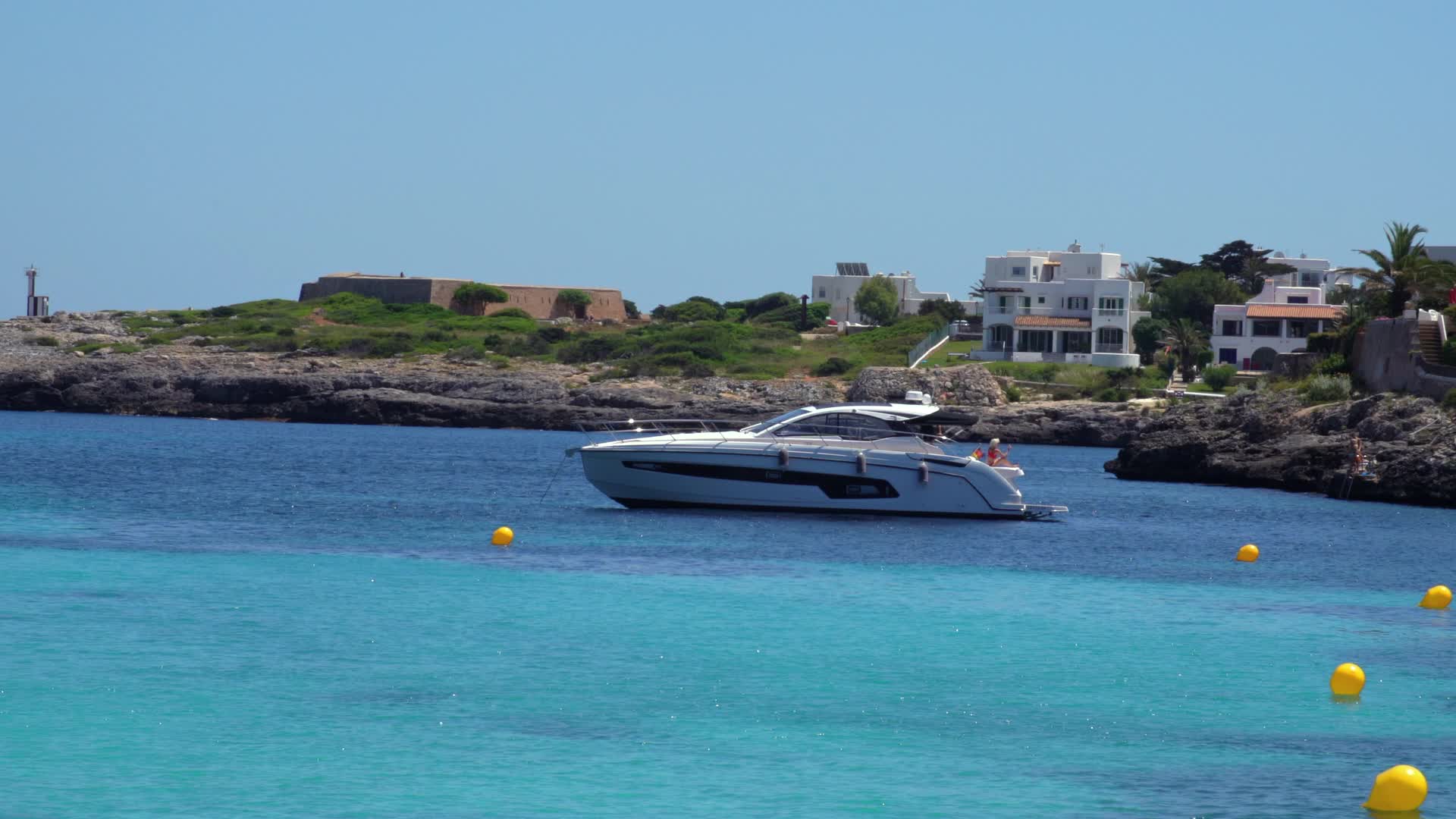 Luxury Yacht at Cala d'Or Beach in Mallorca, Spain on a Sunny Day