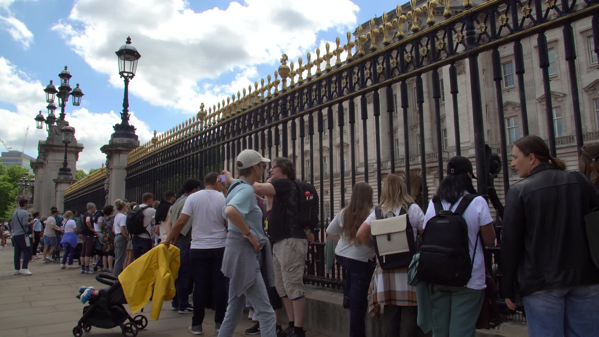 Tourists Gather at Buckingham Palace Gates