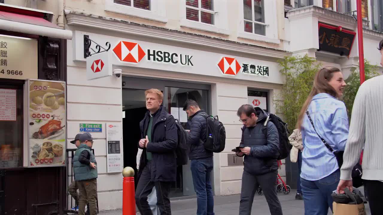 Busy Street Scene Outside HSBC UK in Urban Setting