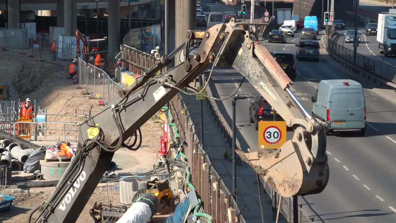 Urban Construction Site Next to Busy Road