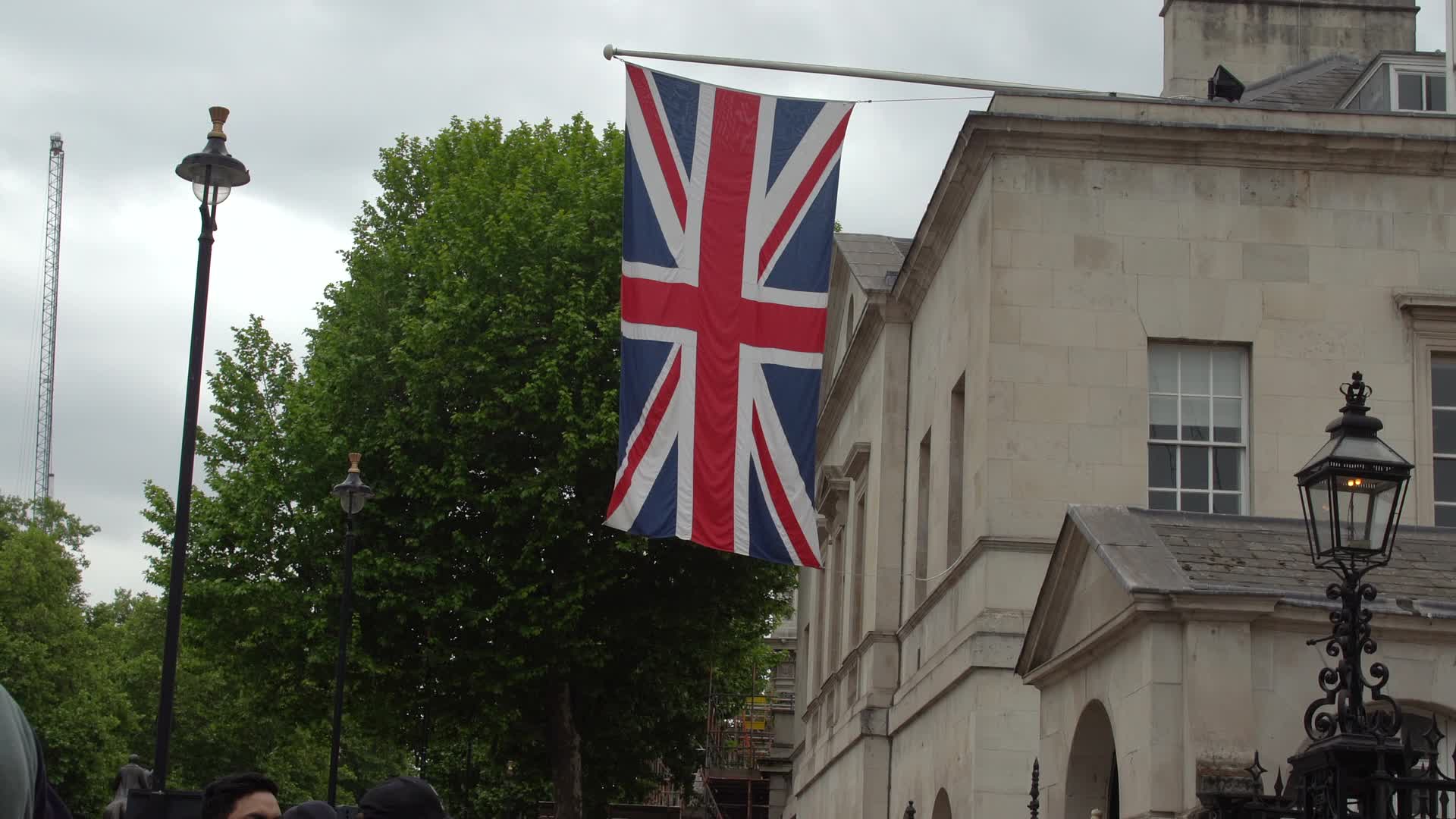 Union Jack Flag and King's Guard in Front of Historic Building, London