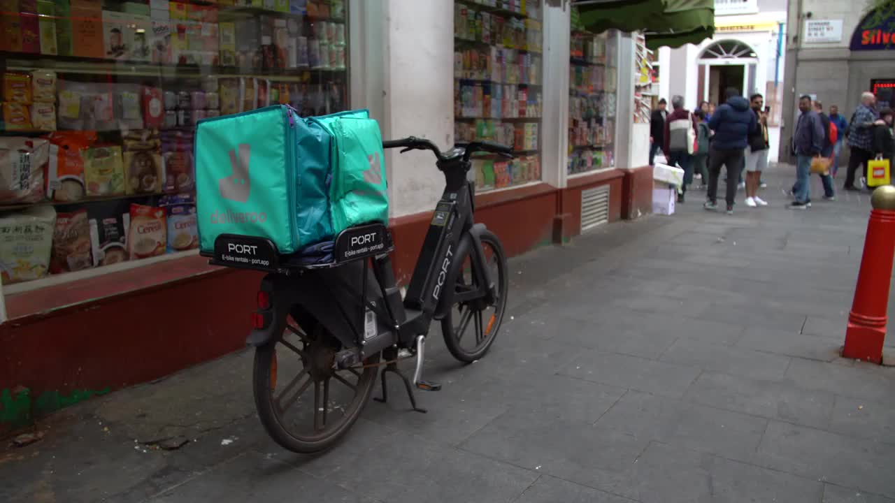 Deliveroo E-Bike Delivery Outside London Shop