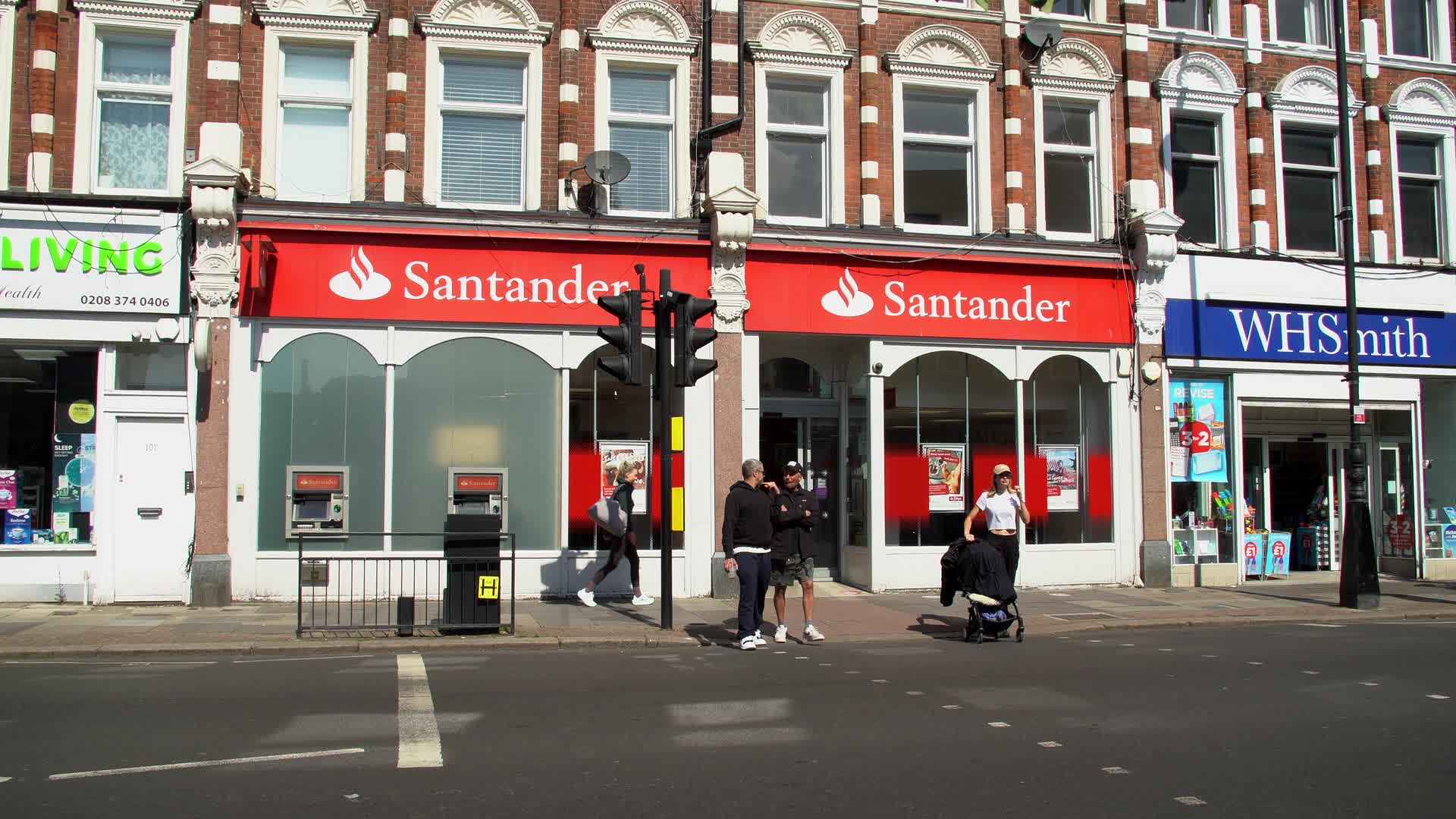 Santander Bank Exterior with Pedestrians in Urban Setting