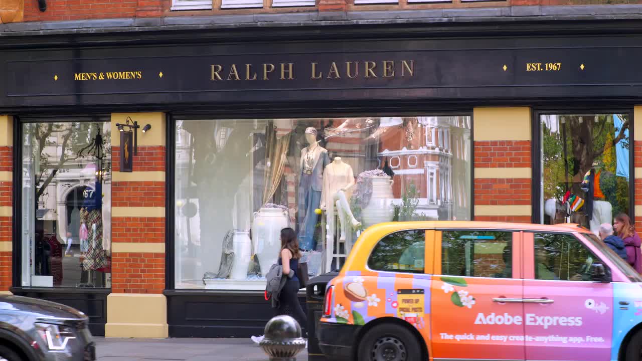 Ralph Lauren Storefront with Passing Taxi in London