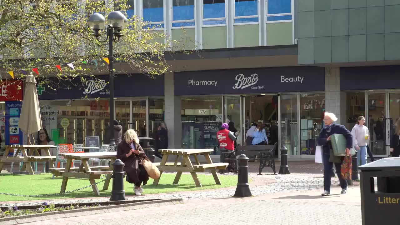 Busy Urban Scene Outside Pharmacy and Beauty Store
