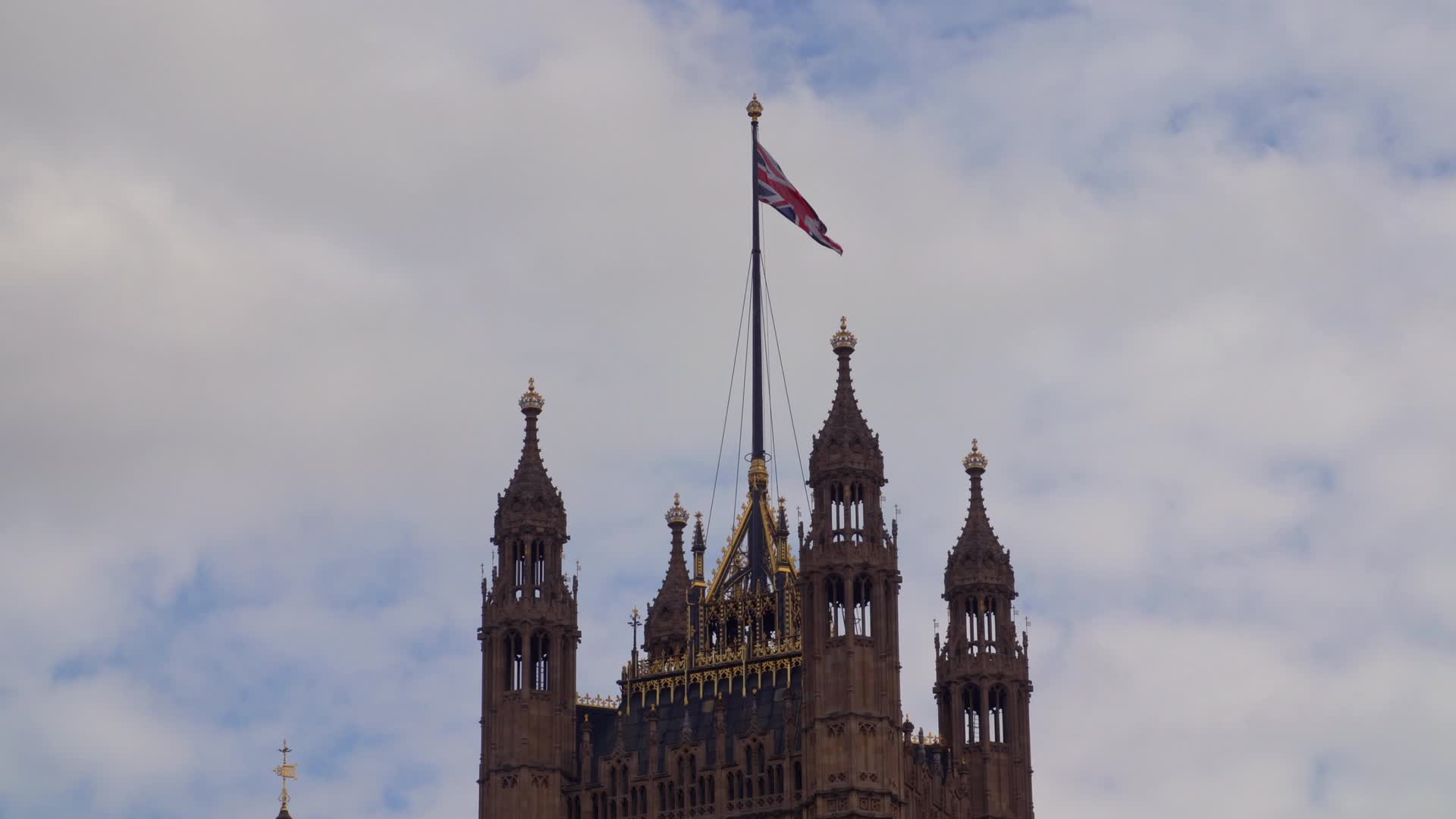 Big Ben and UK Parliament on a Cloudy Day in London, UK