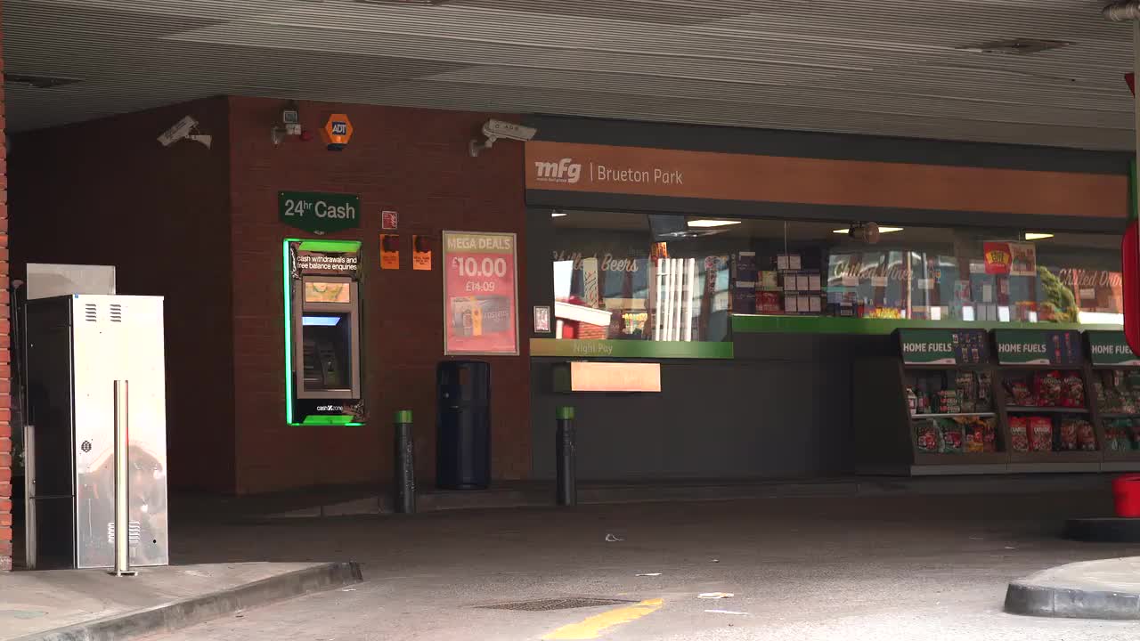 Petrol Station Forecourt with 24-Hour ATM and Shop Display