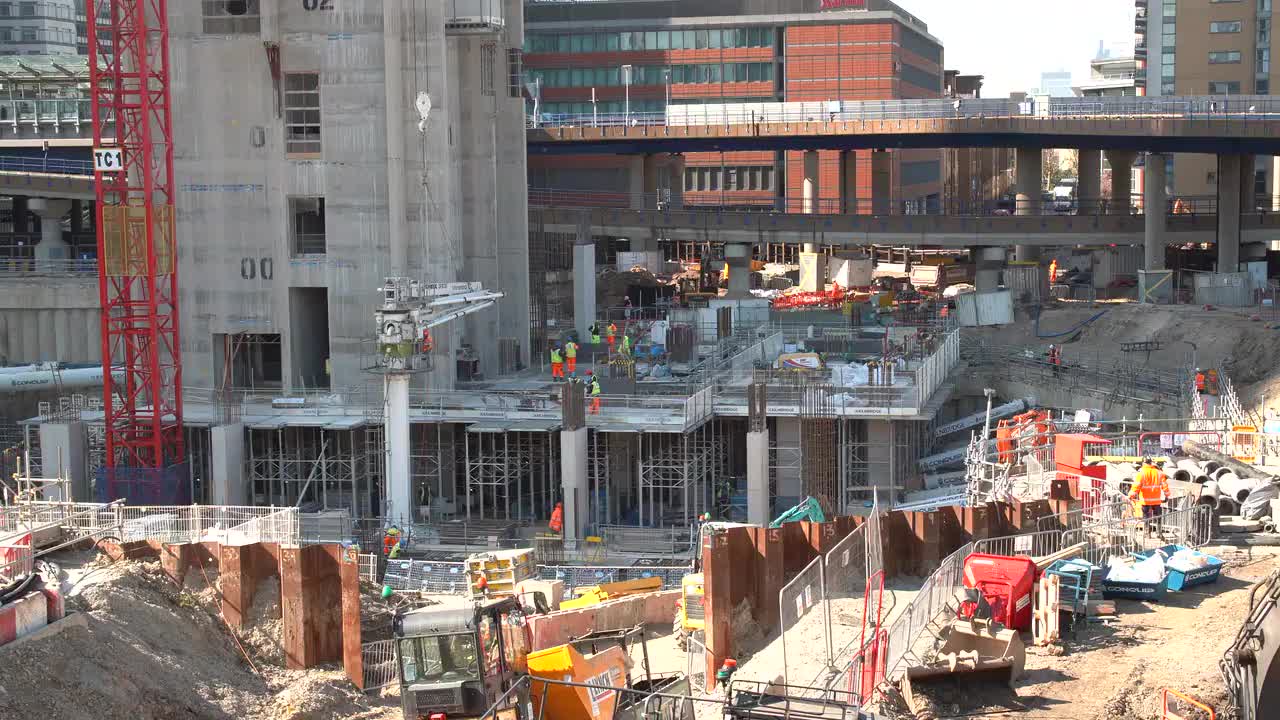 Urban Construction Site with Workers and Machinery