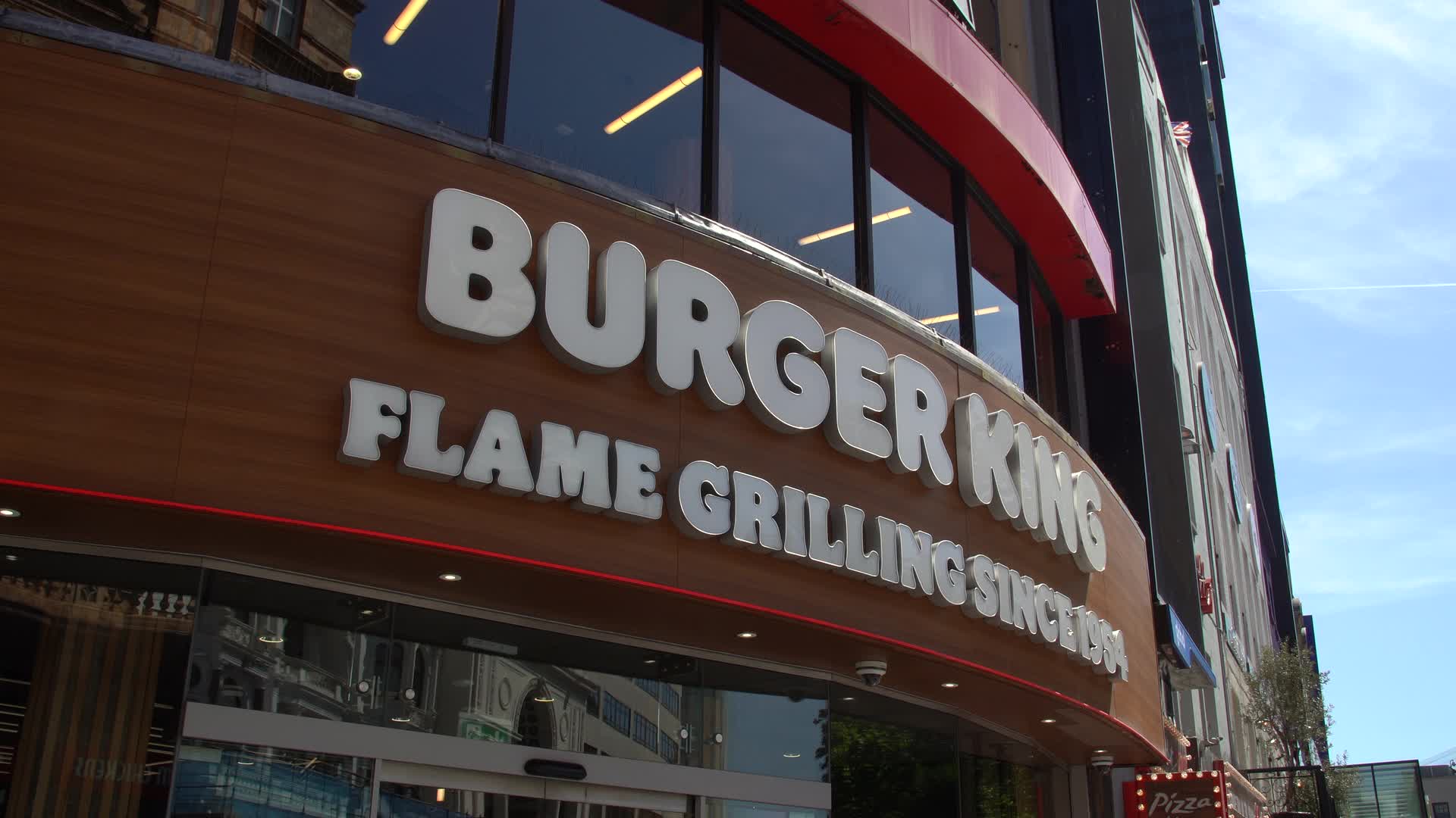 Modern Burger King Storefront on Busy City Street