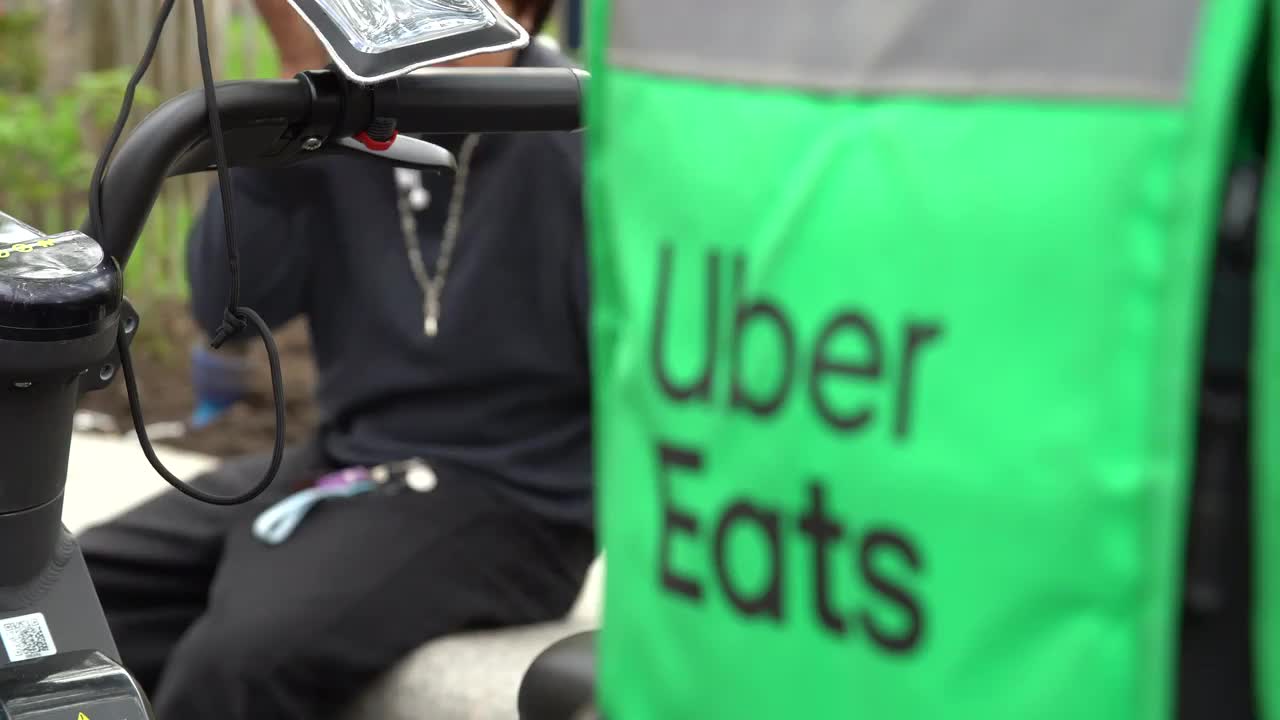 Uber Eats Delivery Rider Preparing for Service