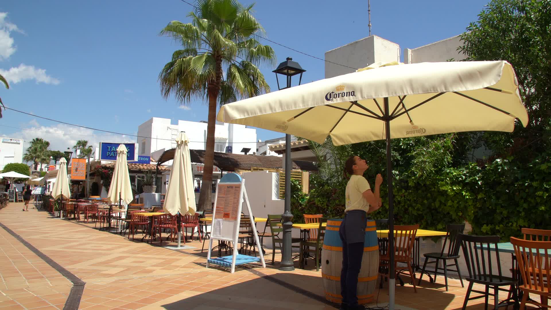 Sunny Streets with Outdoor Cafes in Cala d'Or, Mallorca, Spain