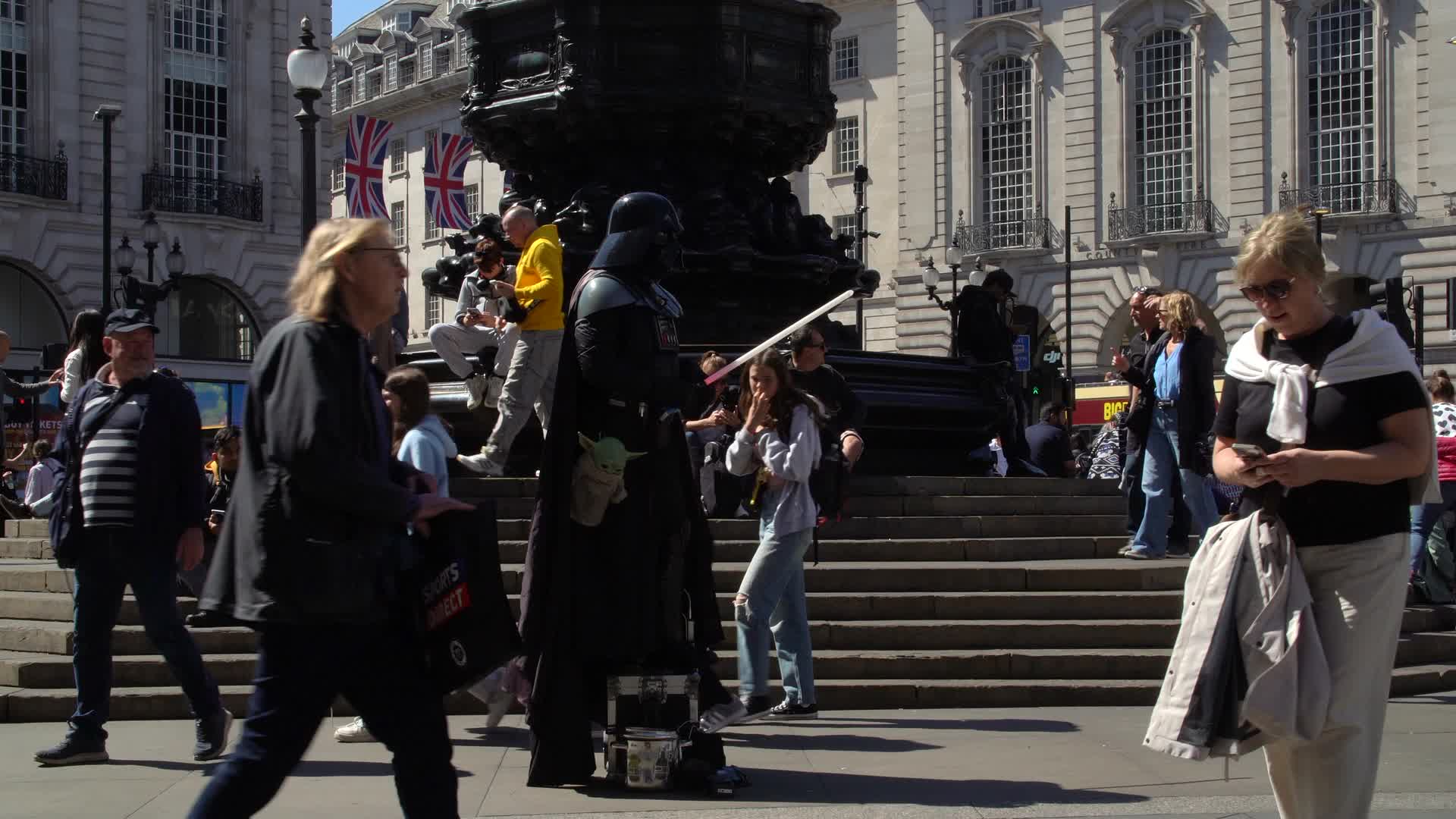 Vibrant Day at Piccadilly Circus - Street Performers and Pedestrians