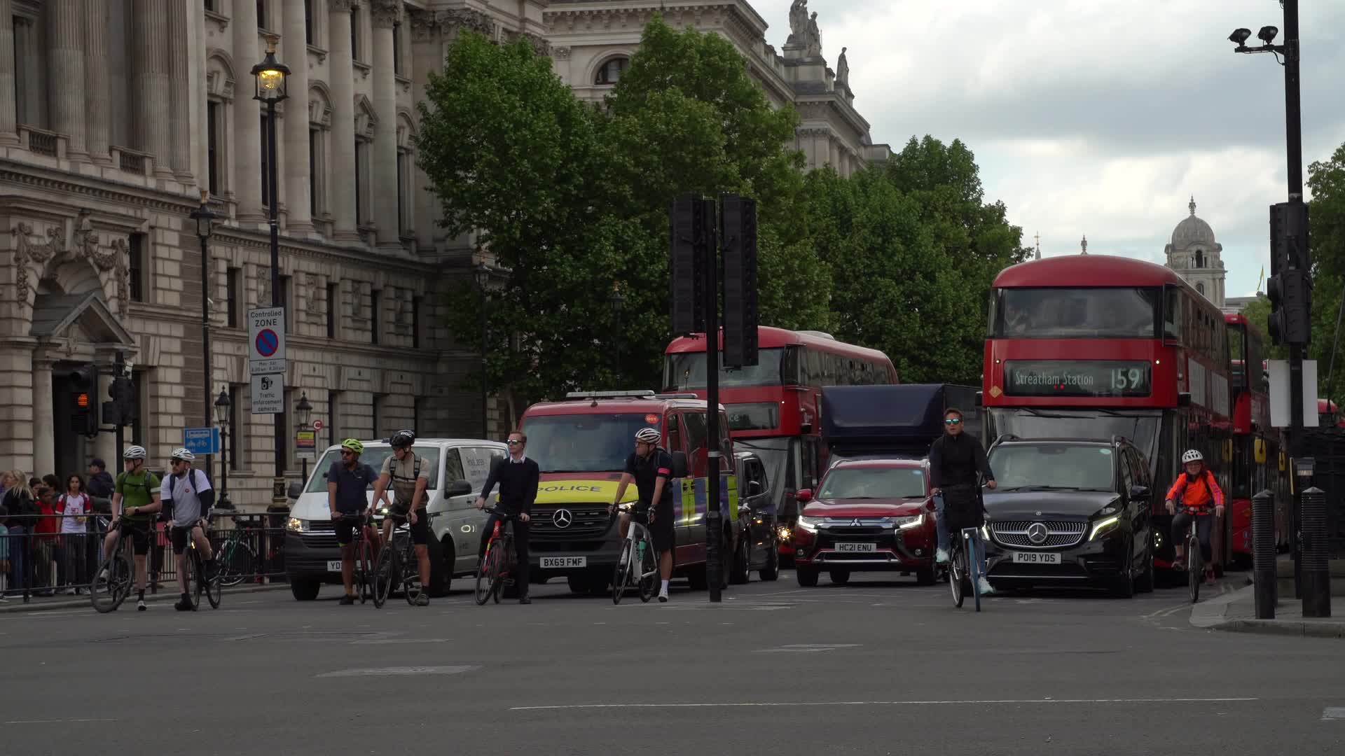 London Traffic and Cyclists in Busy Street