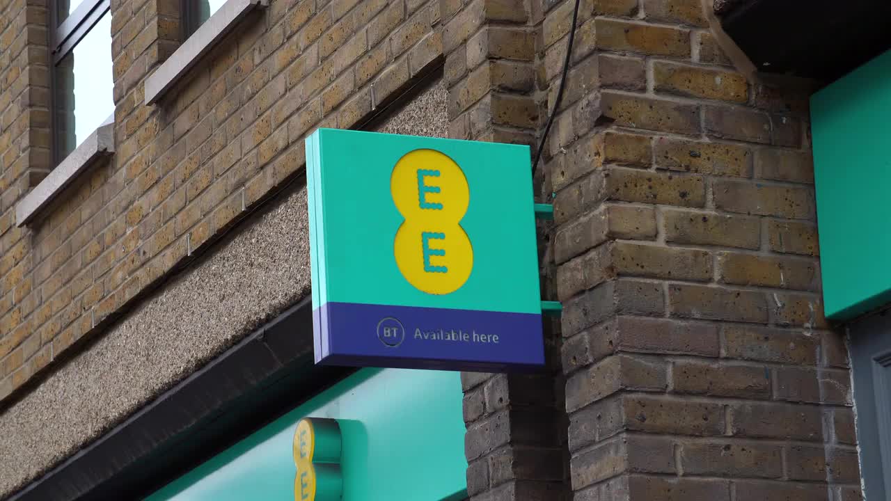 EE Storefront Sign on Urban Brick Wall
