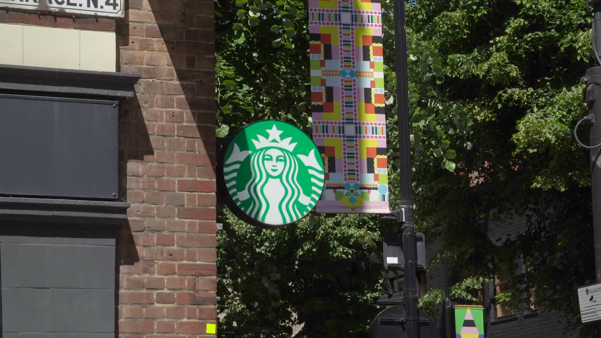 Starbucks Sign on Storefront in London, UK