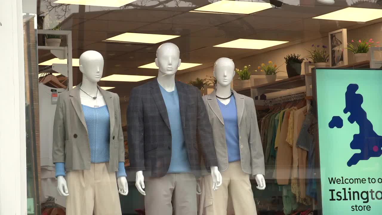 Mannequins Display Fashion Collection in Islington Storefront