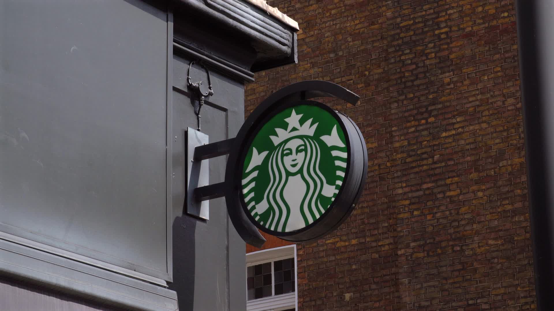 Starbucks Coffee Shop Sign on Urban Wall in London, UK