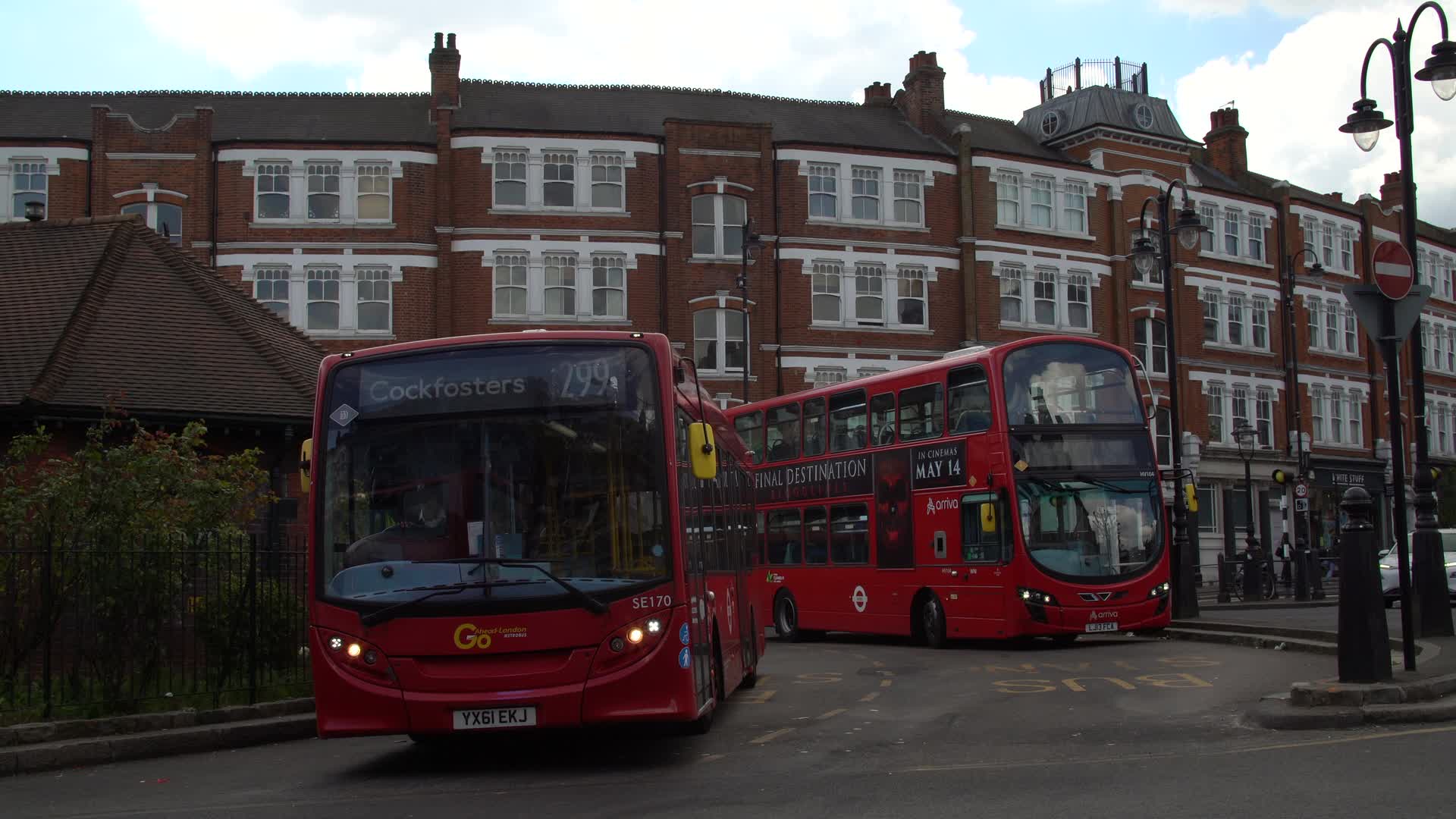 Iconic London Red Buses on City Streets