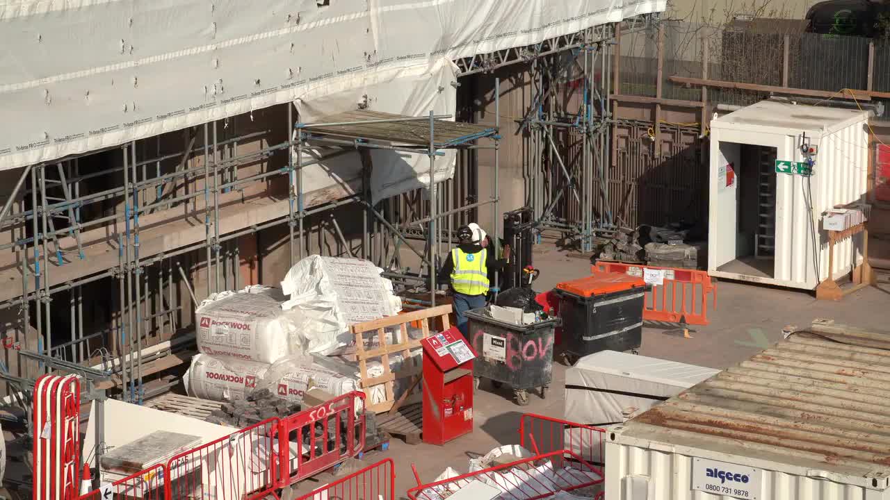 Urban Construction Site with Worker and Materials